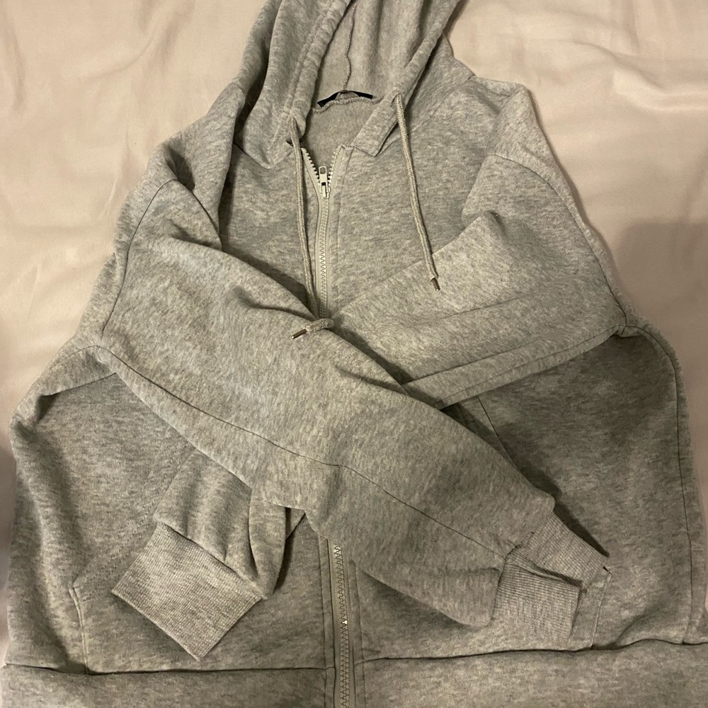 gray zip up jacket, fleece lined. Size M.